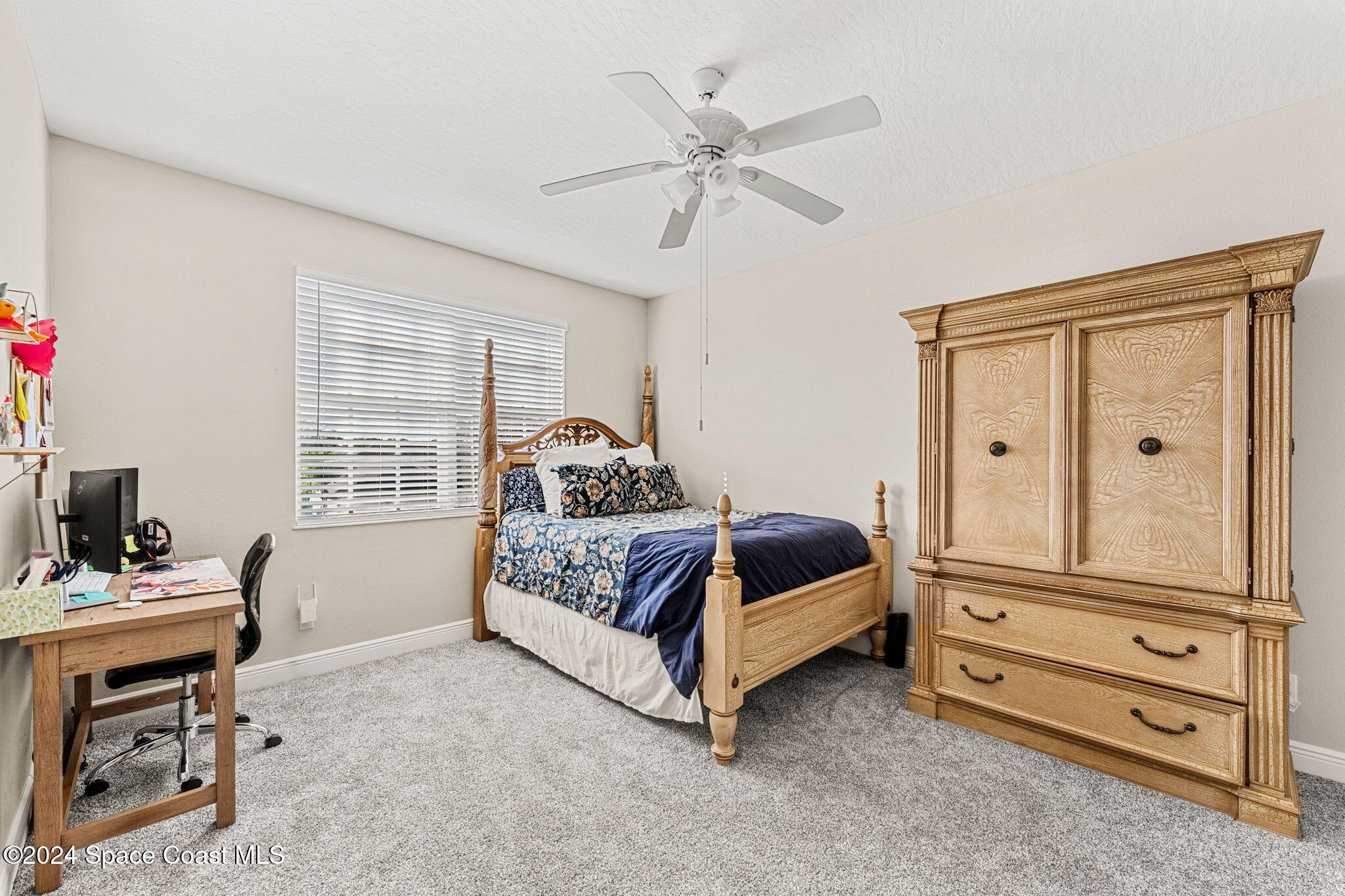 3416 Peninsula Circle Melbourne, FL 32940 - Photo 29 of 61 a bedroom with a bed and a window