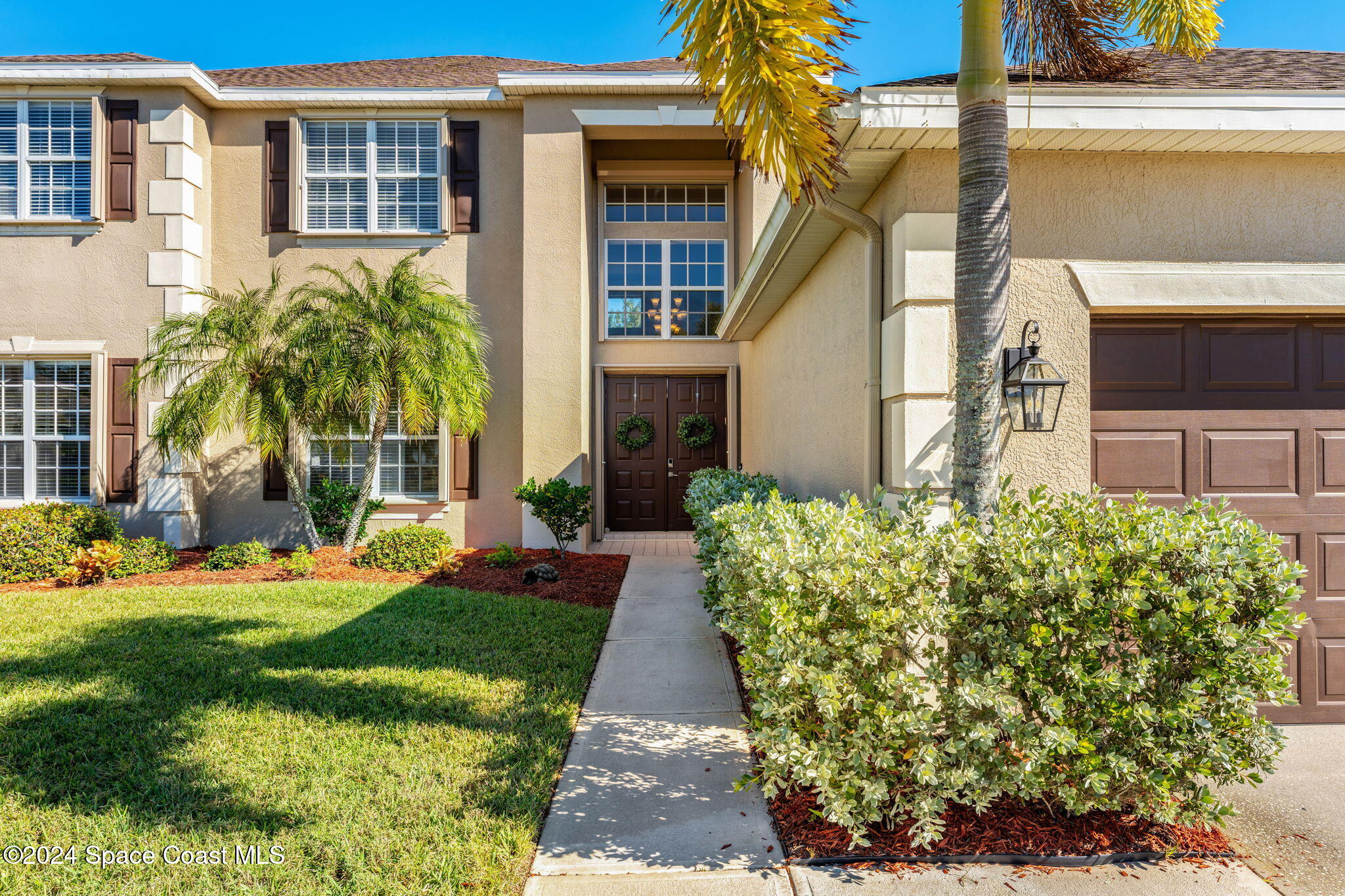3416 Peninsula Circle Melbourne, FL 32940 - Photo 3 of 61 a front view of a house with garden