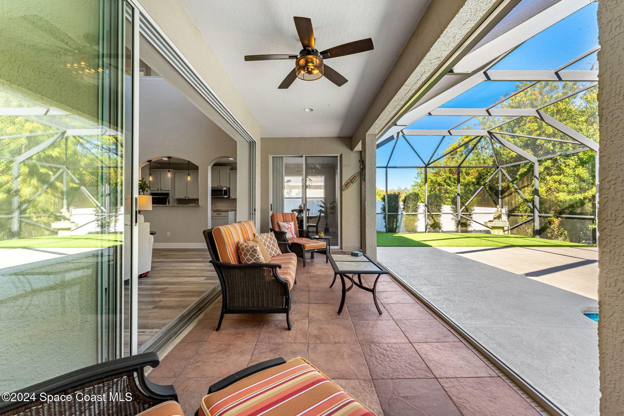 3416 Peninsula Circle Melbourne, FL 32940 - Photo 35 of 61 a living room with furniture and a large window
