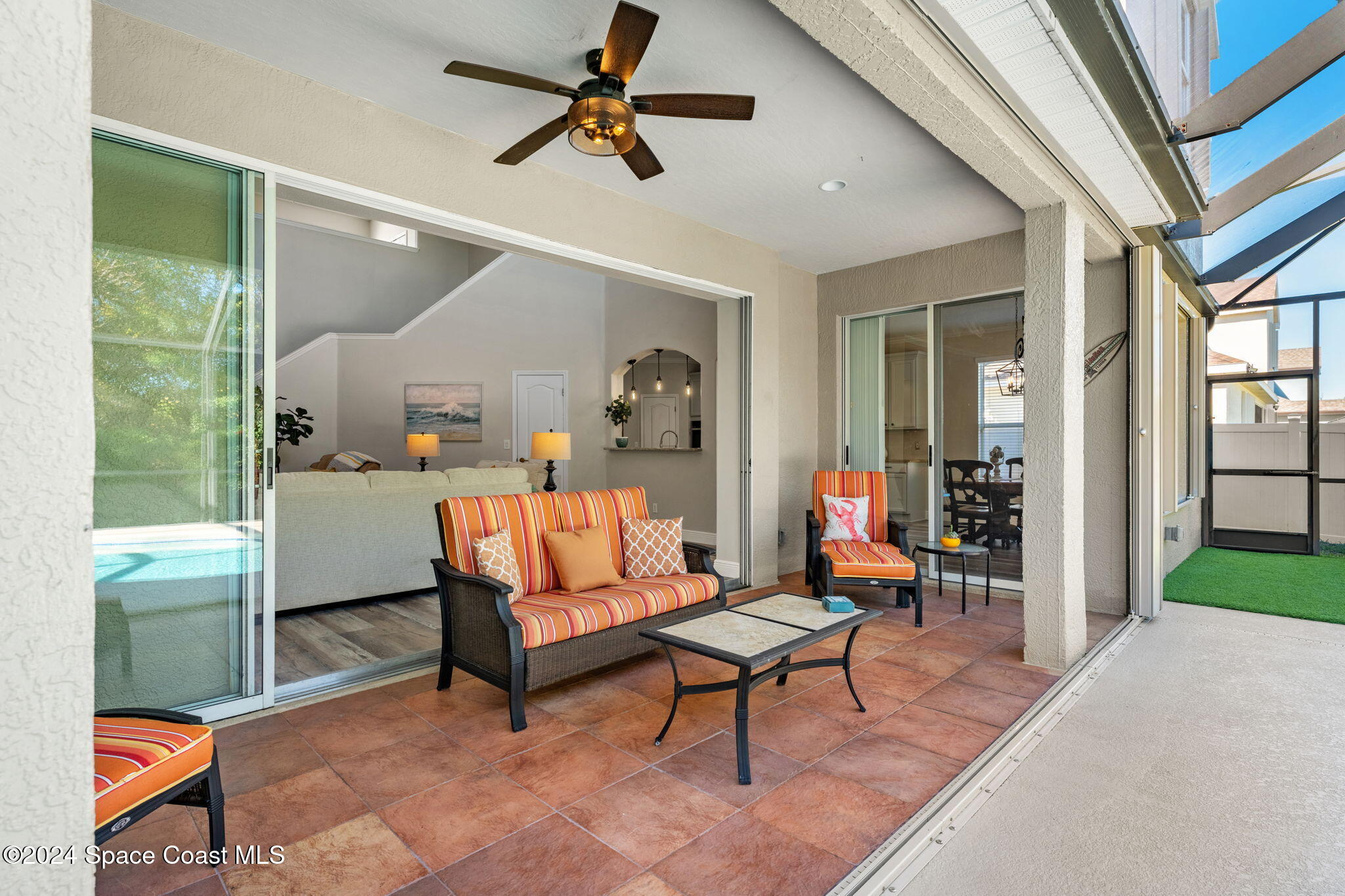 3416 Peninsula Circle Melbourne, FL 32940 - Photo 39 of 61 a living room with furniture a rug and a large window
