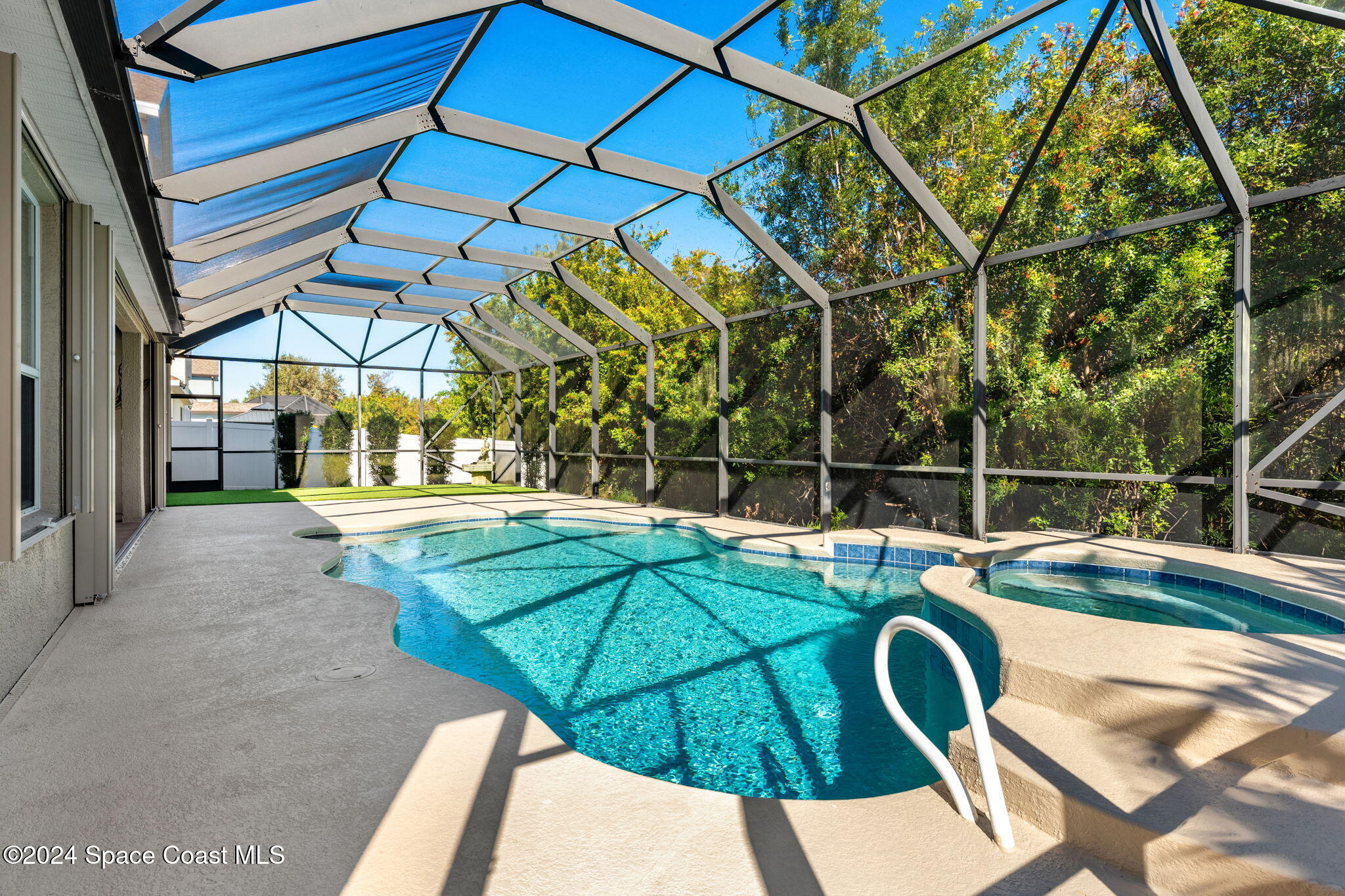 3416 Peninsula Circle Melbourne, FL 32940 - Photo 40 of 61 a view of a house with backyard and sitting area