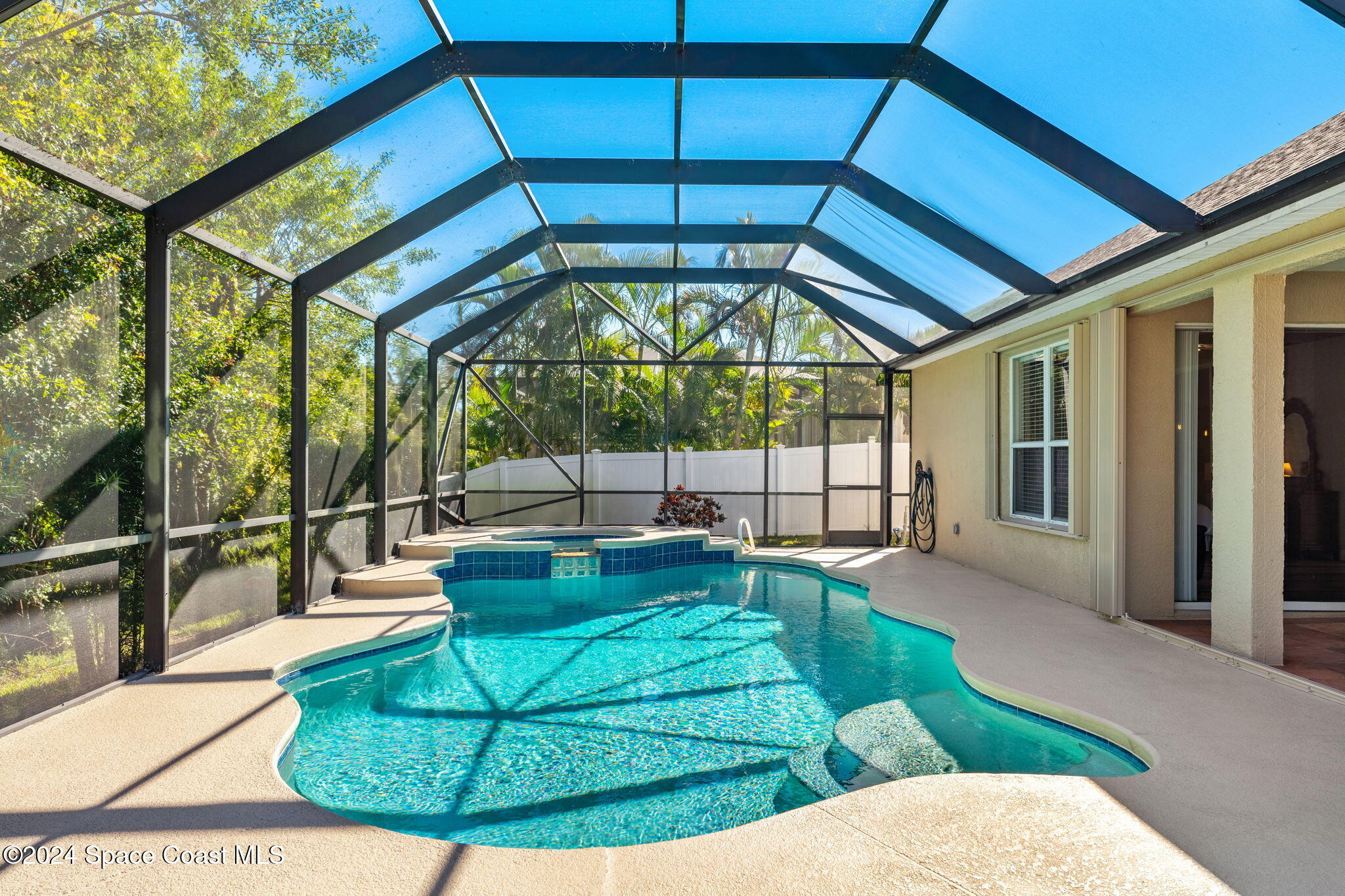 3416 Peninsula Circle Melbourne, FL 32940 - Photo 42 of 61 a view of a swimming pool with a patio