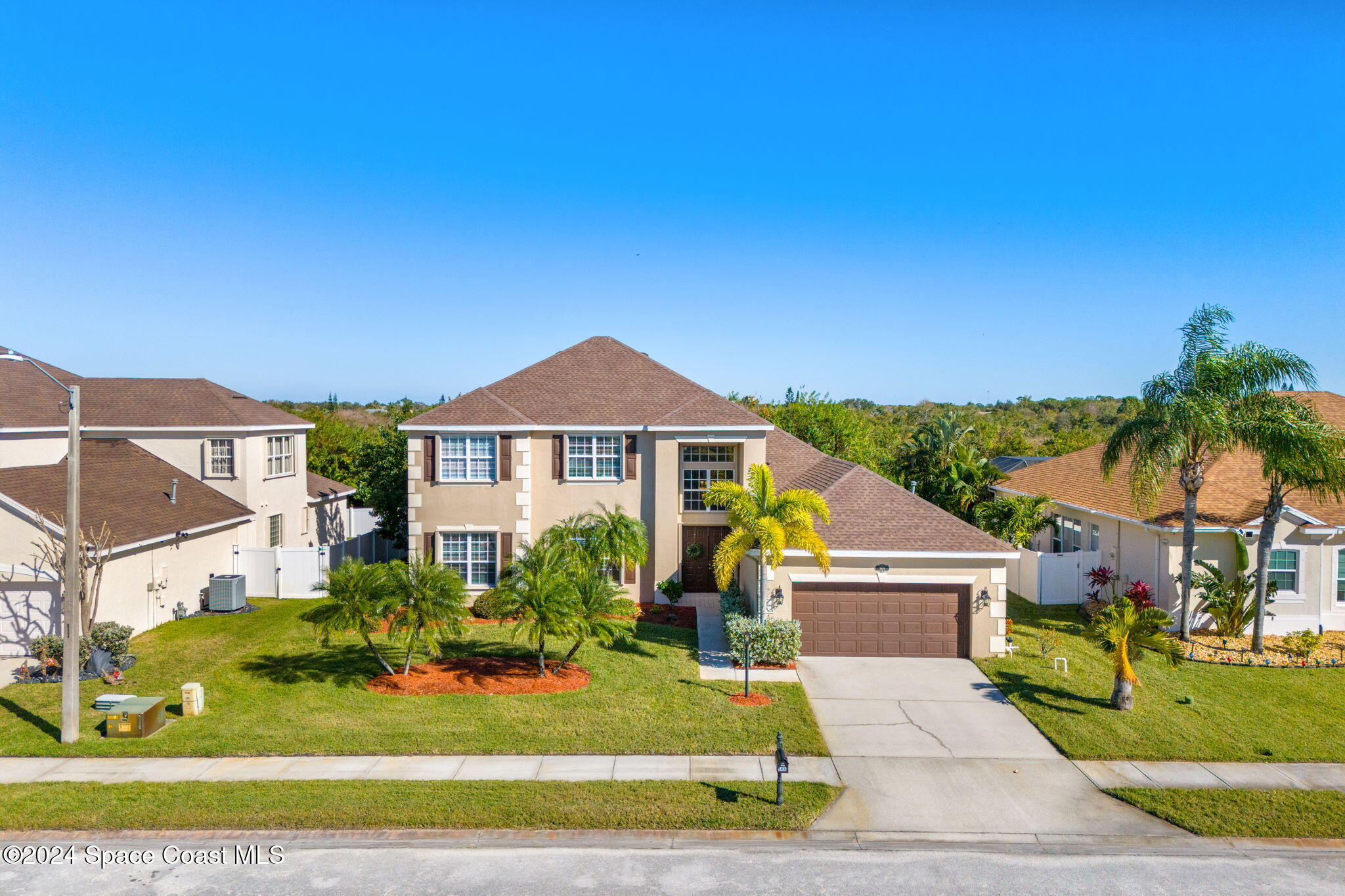3416 Peninsula Circle Melbourne, FL 32940 - Photo 45 of 61 a front view of a house with a yard