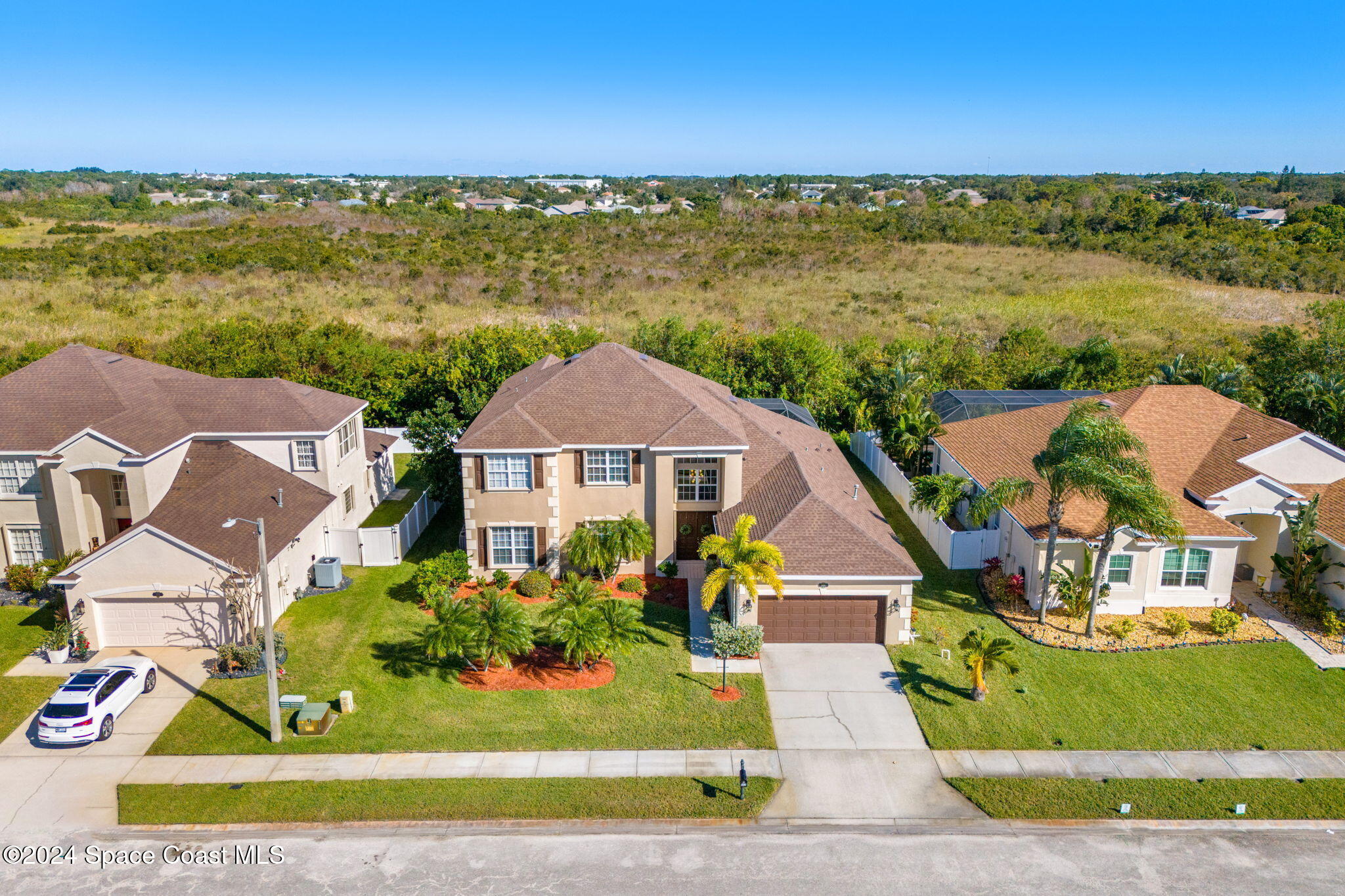 3416 Peninsula Circle Melbourne, FL 32940 - Photo 46 of 61 an aerial view of residential houses with outdoor space and ocean view