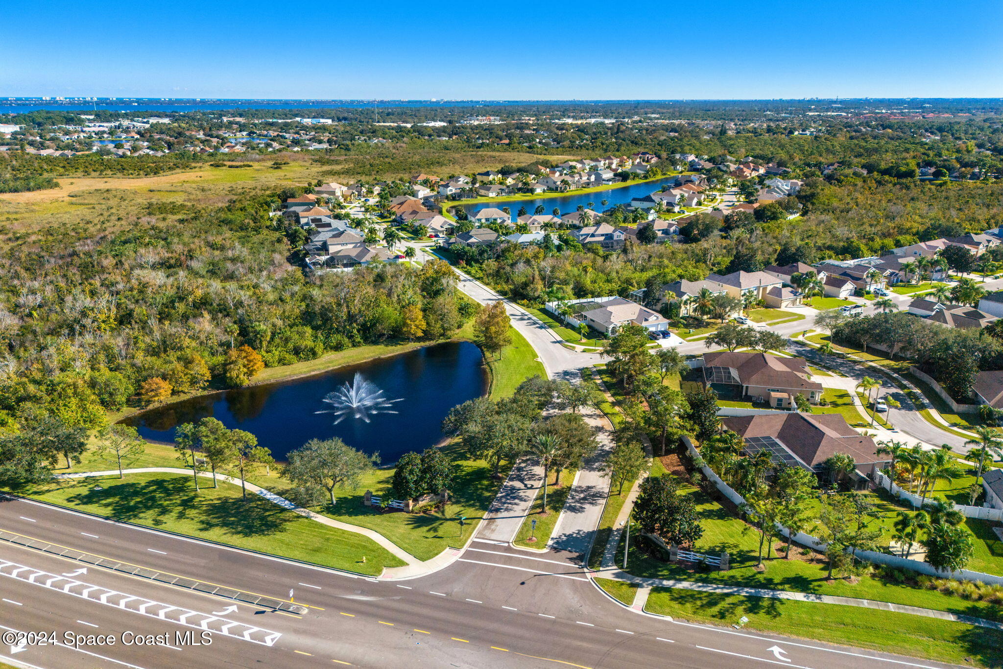 3416 Peninsula Circle Melbourne, FL 32940 - Photo 51 of 61 an aerial view of residential houses with outdoor space and swimming pool