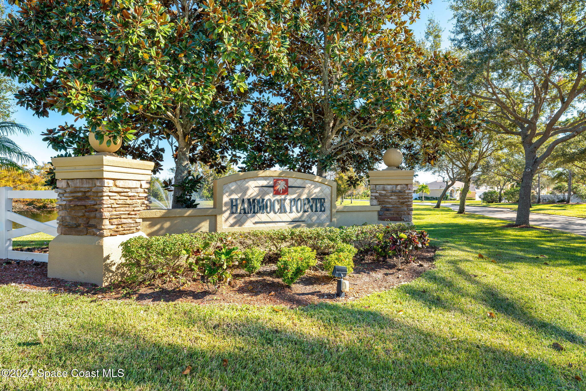 3416 Peninsula Circle Melbourne, FL 32940 - Photo 52 of 61 a front view of a house with a yard