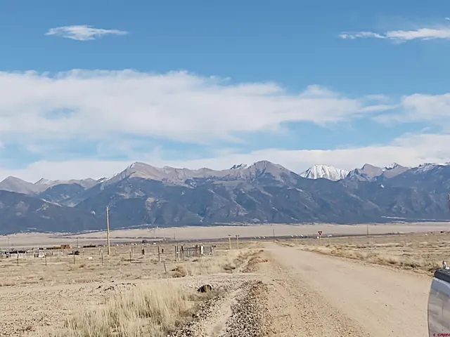 an aerial view of mountain with beach