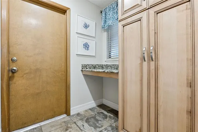a bathroom with a shower and a sink
