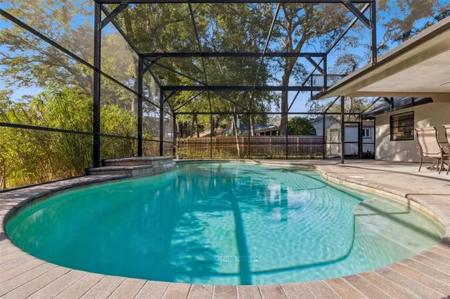 a view of a swimming pool with a patio