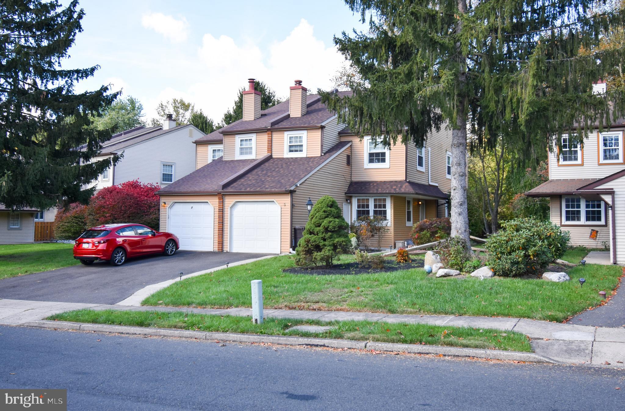 5 Sandy Ridge Drive Doylestown, PA 18901 - Photo 1 of 24 a front view of a house with a yard and garage
