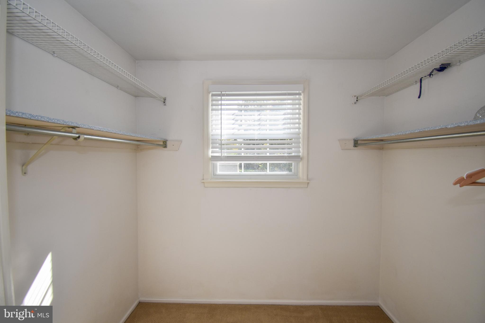 5 Sandy Ridge Drive Doylestown, PA 18901 - Photo 12 of 24 a view of a room with rack on the wall and a window