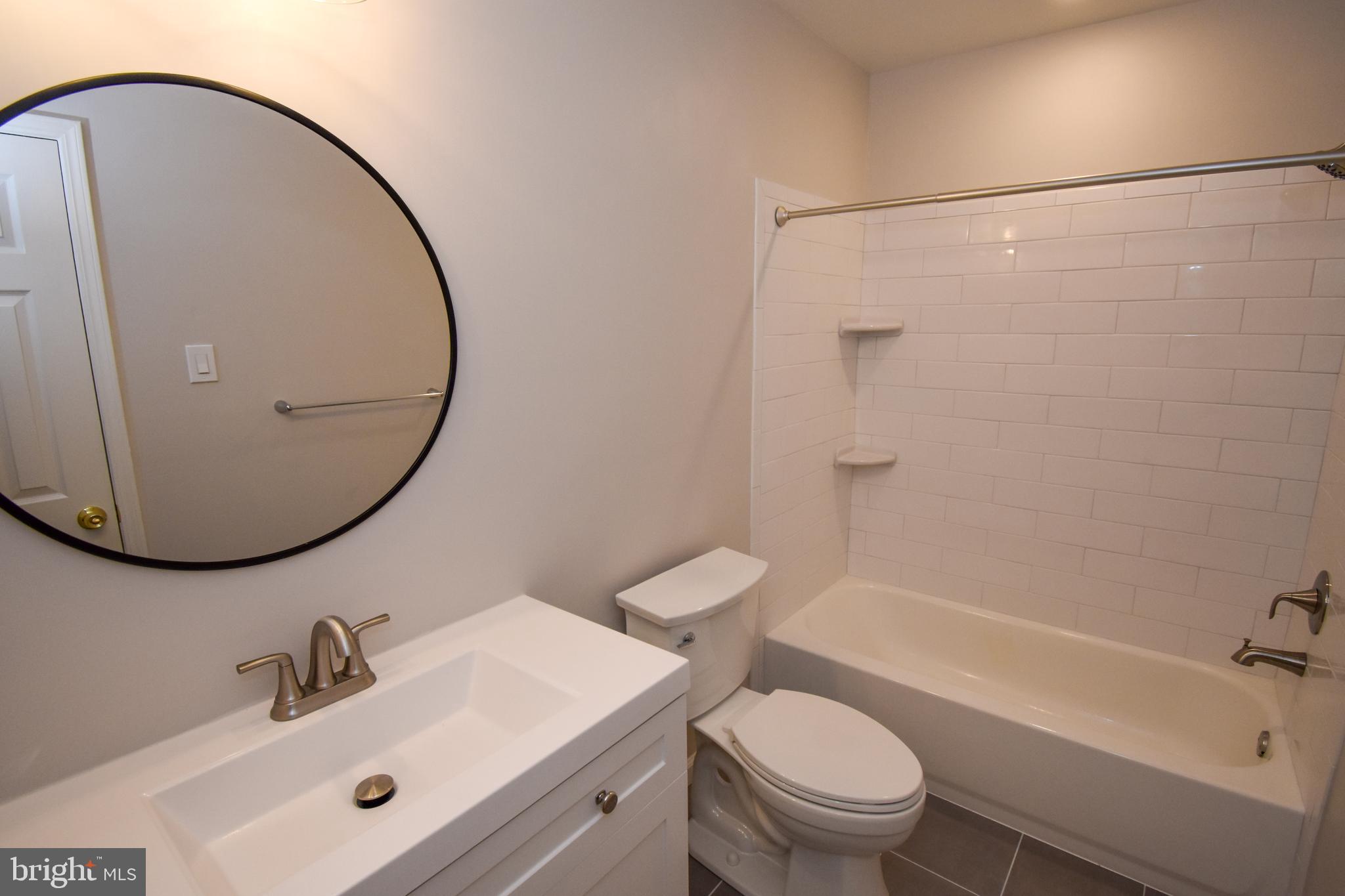 5 Sandy Ridge Drive Doylestown, PA 18901 - Photo 17 of 24 a bathroom with a sink mirror toilet and shower