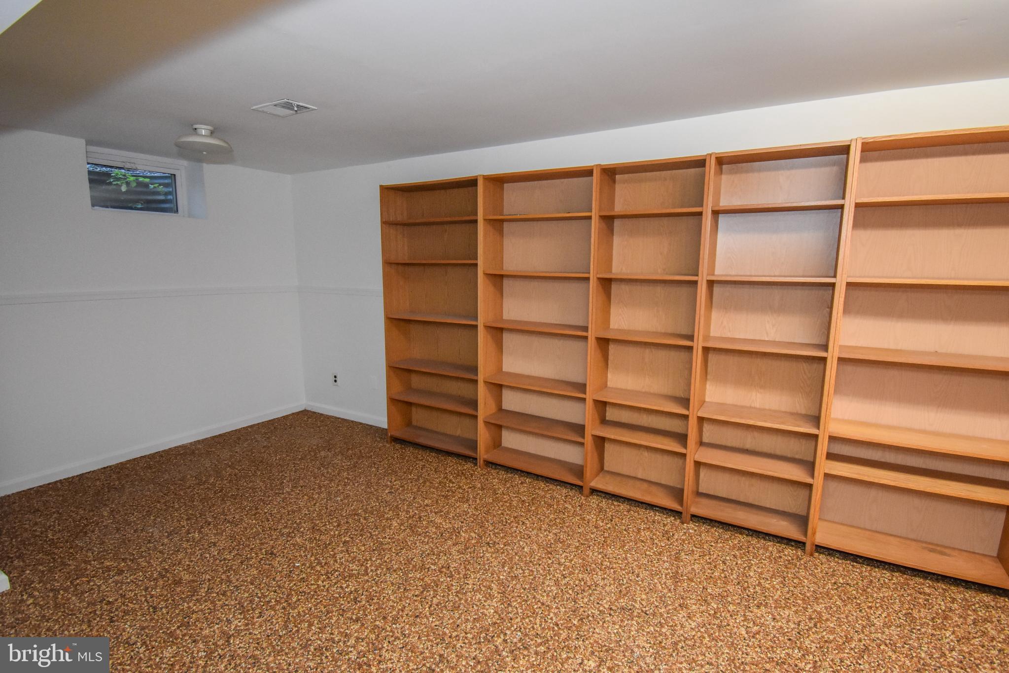 5 Sandy Ridge Drive Doylestown, PA 18901 - Photo 22 of 24 a view of an empty room with empty shelves