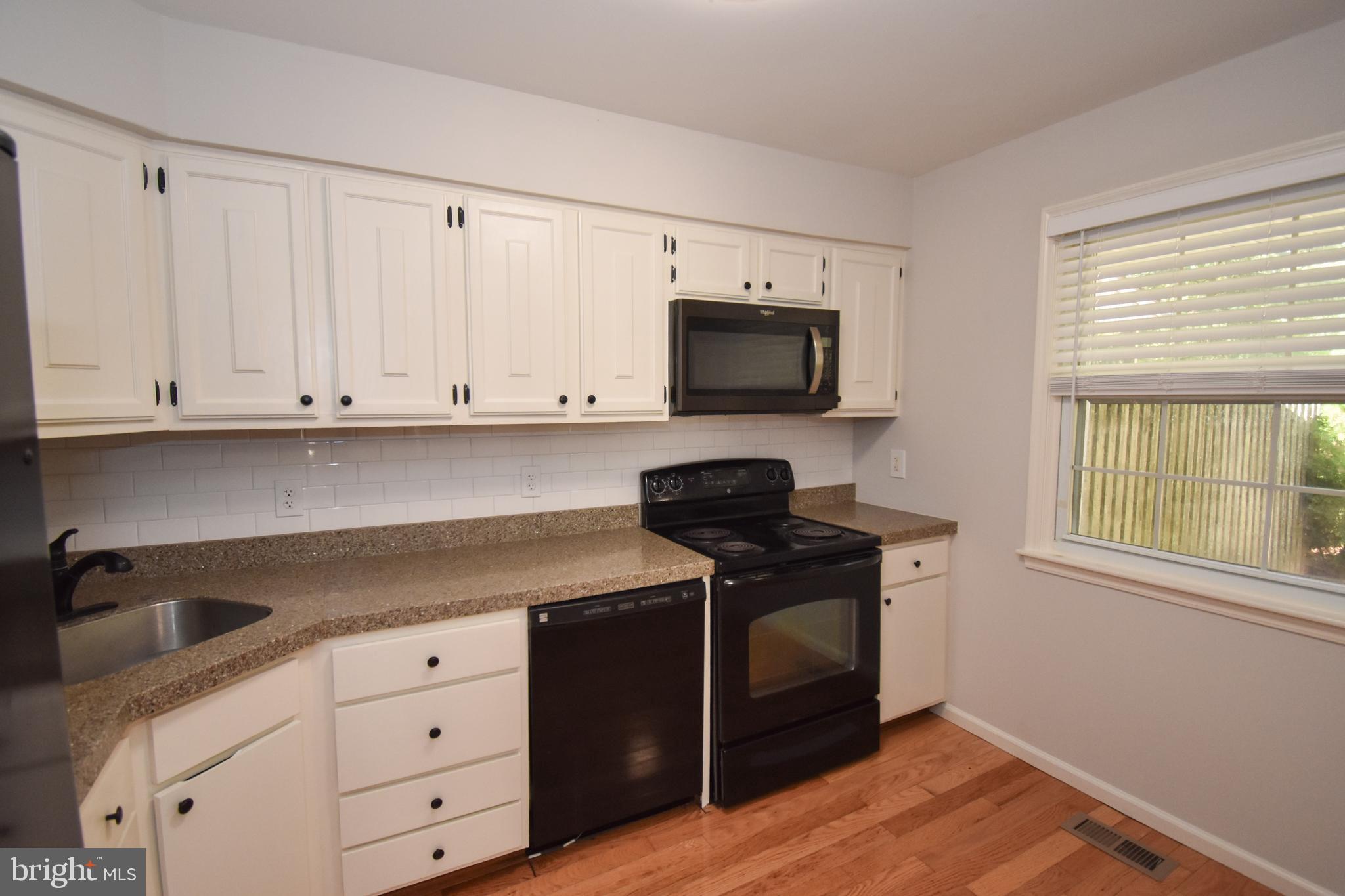 5 Sandy Ridge Drive Doylestown, PA 18901 - Photo 6 of 24 a kitchen with a sink and a stove top oven
