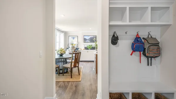 a view of a dining room with furniture and wooden floor