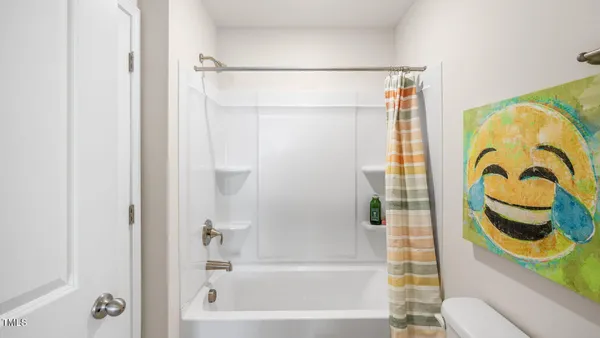 a bathroom with a shower and a bathtub