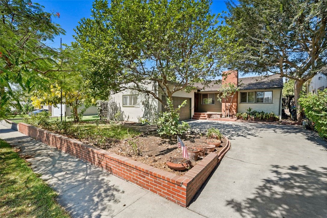 14335 Aztec Street Sylmar, CA 91342 - Photo 2 of 48 a view of a house with backyard and sitting area