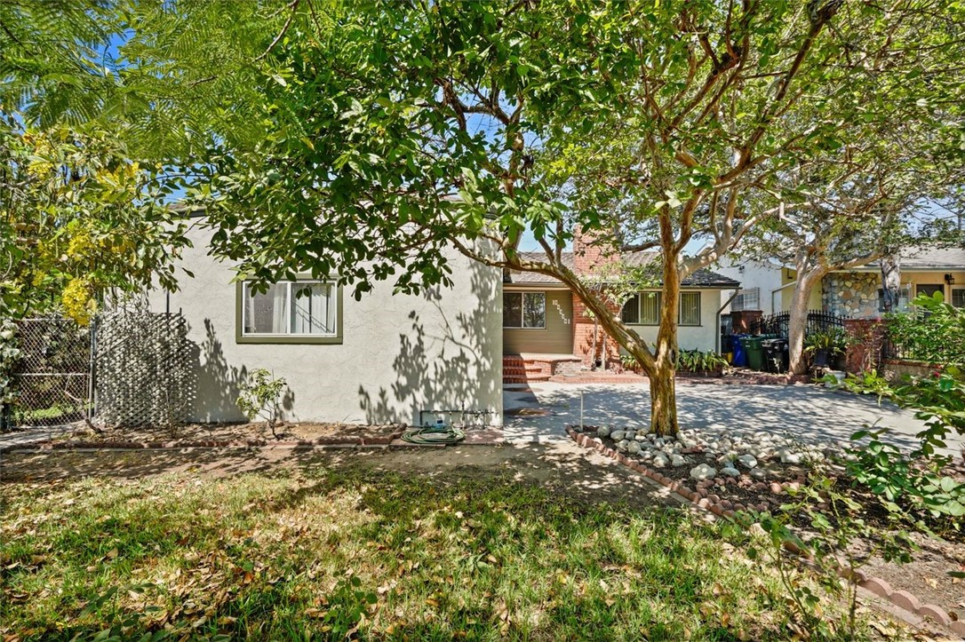 14335 Aztec Street Sylmar, CA 91342 - Photo 3 of 48 a backyard of a house with large trees