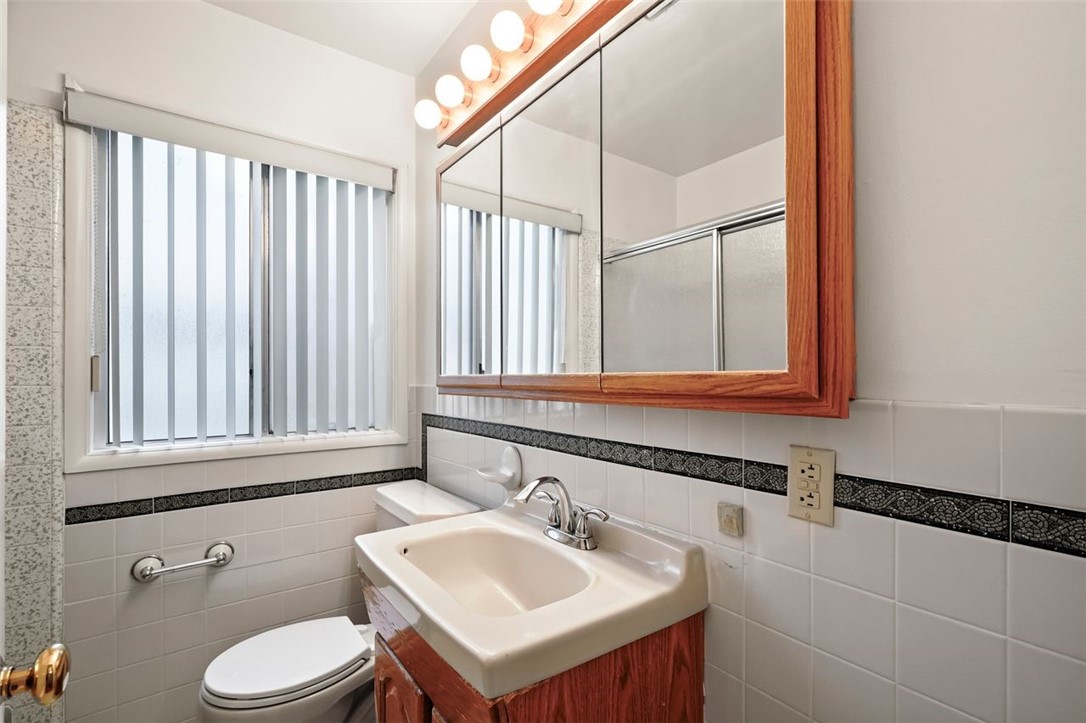 14335 Aztec Street Sylmar, CA 91342 - Photo 33 of 48 a bathroom with a sink and a toilet