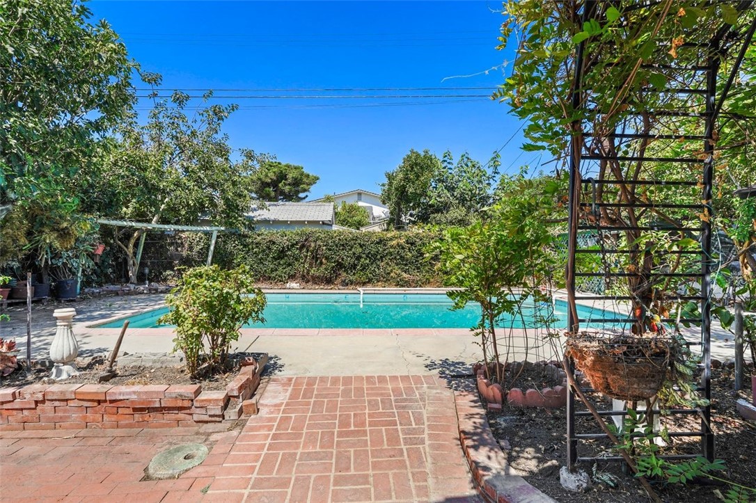 14335 Aztec Street Sylmar, CA 91342 - Photo 37 of 48 a view of backyard with outdoor seating and green space