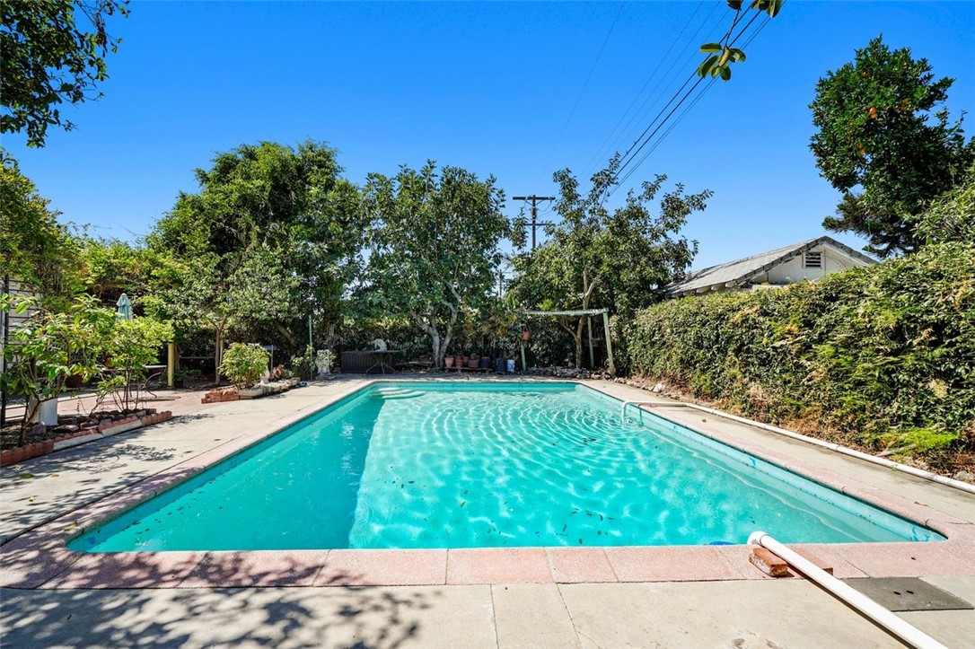 14335 Aztec Street Sylmar, CA 91342 - Photo 41 of 48 a view of a backyard with plants and a bench
