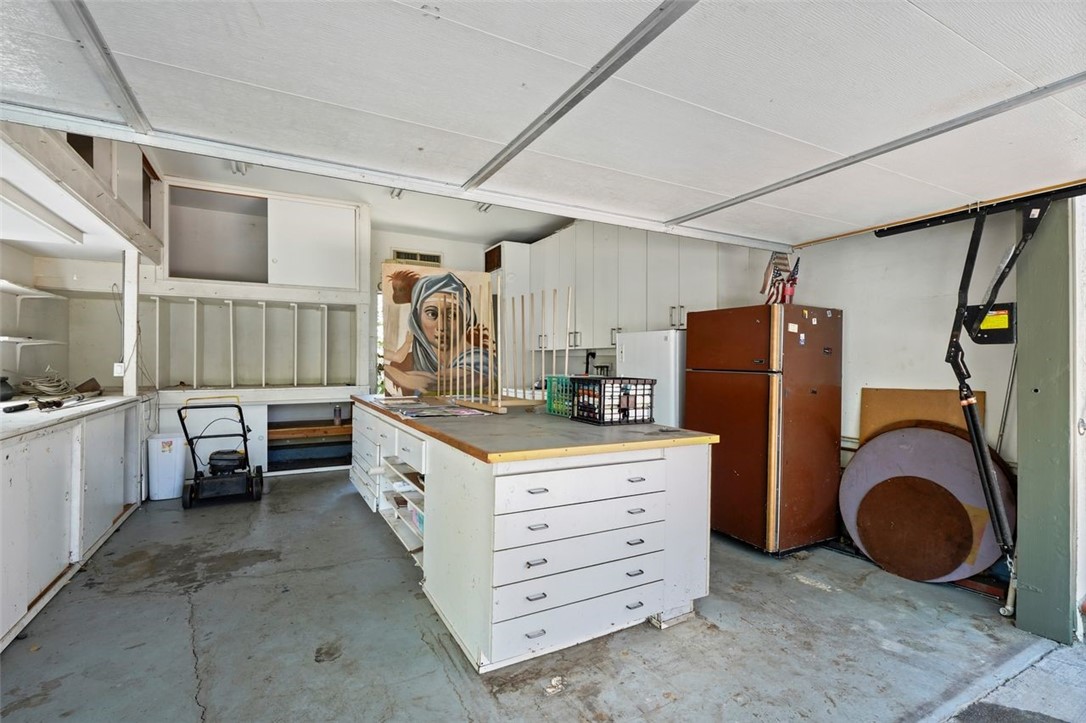 14335 Aztec Street Sylmar, CA 91342 - Photo 43 of 48 a kitchen with refrigerator and cabinets