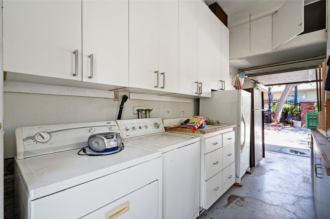 14335 Aztec Street Sylmar, CA 91342 - Photo 44 of 48 a kitchen with cabinets and appliances