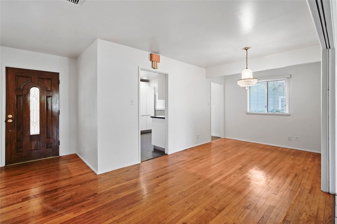 14335 Aztec Street Sylmar, CA 91342 - Photo 8 of 48 a view of empty room with wooden floor and fan