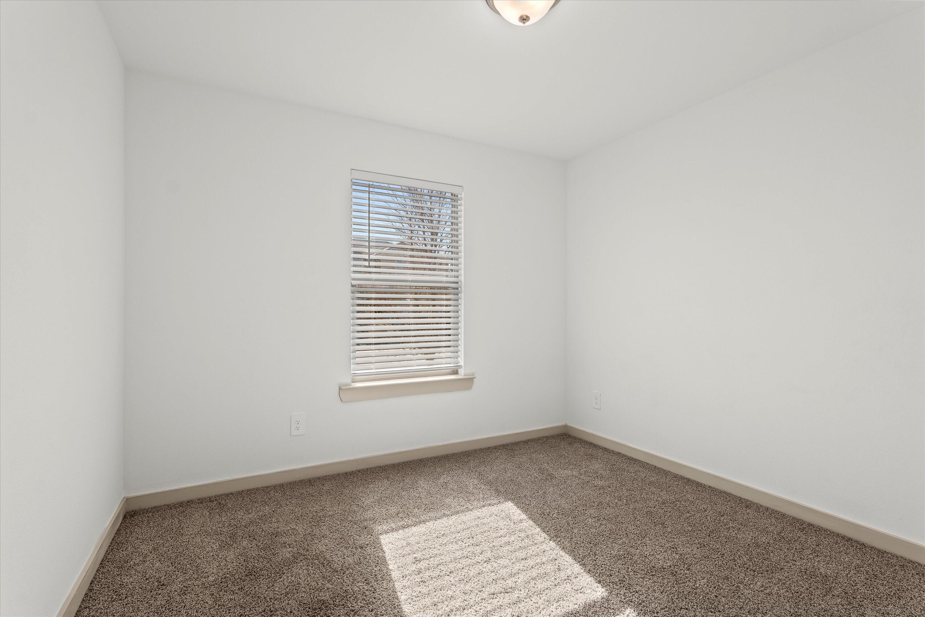7416 9th Street Lubbock, TX 79416 - Photo 20 of 31 an empty room with a window