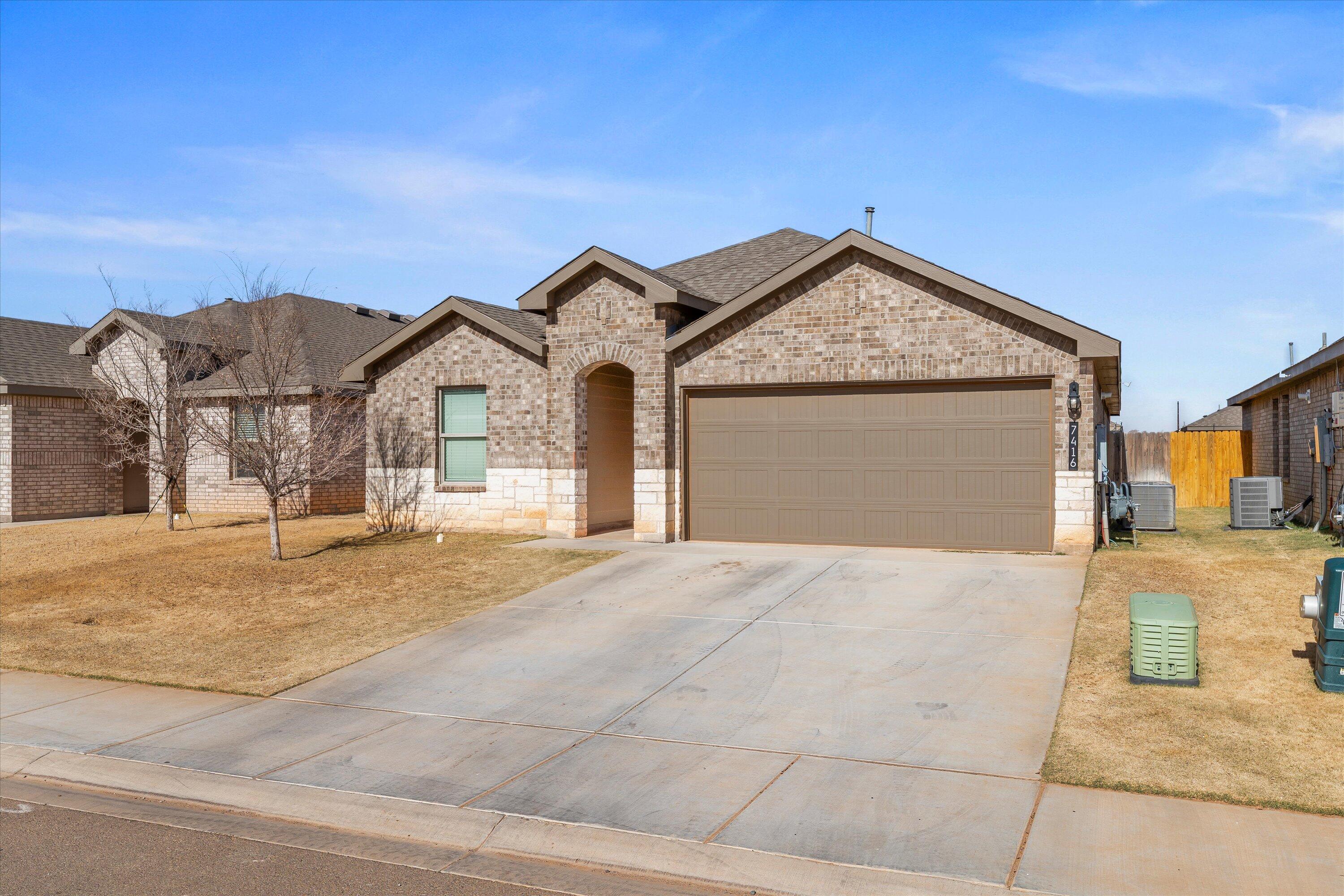 7416 9th Street Lubbock, TX 79416 - Photo 2 of 31 a view of yellow house with a outdoor space