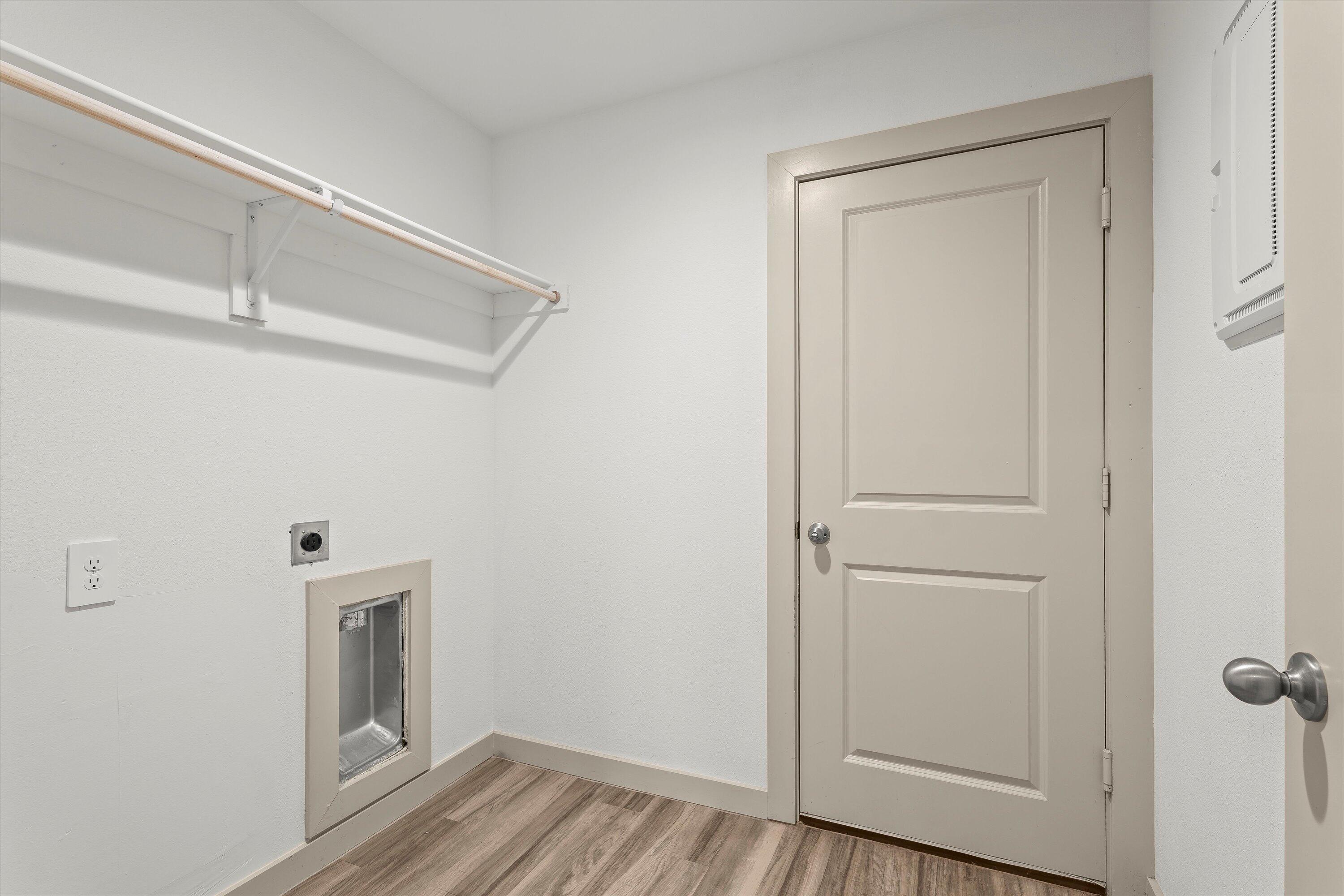 7416 9th Street Lubbock, TX 79416 - Photo 26 of 31 a view of a hallway with a wooden floor