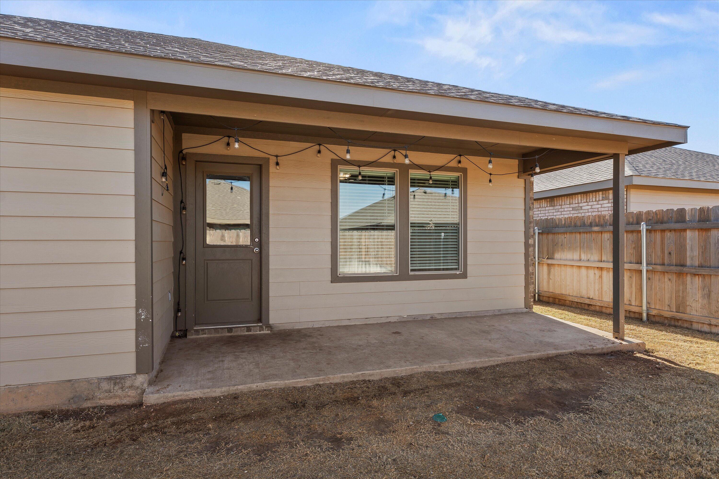 7416 9th Street Lubbock, TX 79416 - Photo 30 of 34 wooden floor and window in an empty room