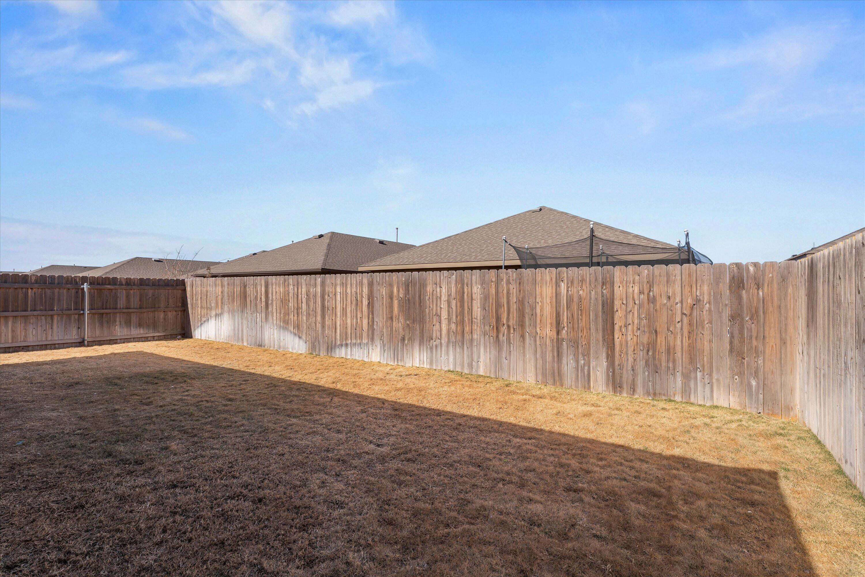 7416 9th Street Lubbock, TX 79416 - Photo 30 of 31 a backyard of a house