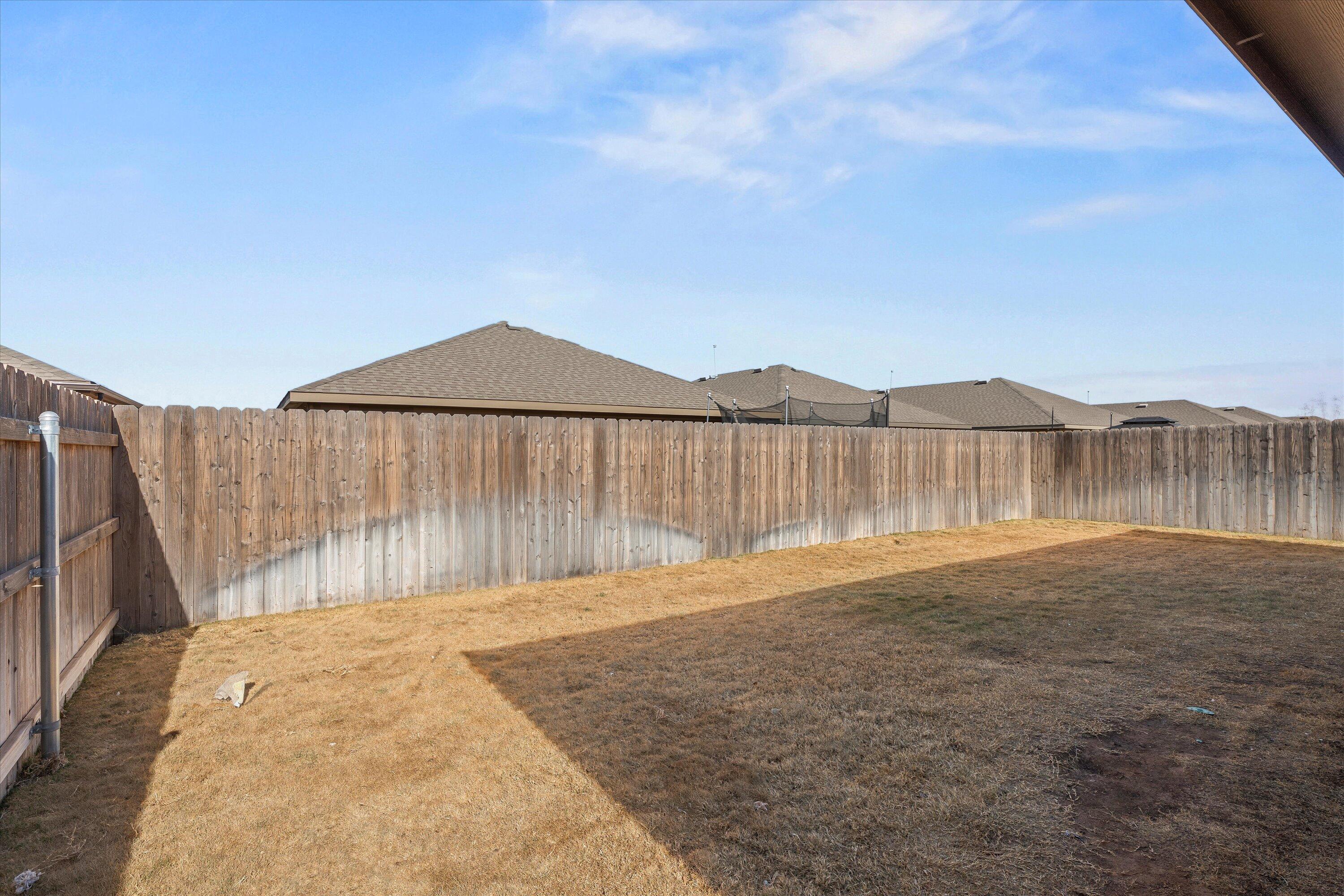 7416 9th Street Lubbock, TX 79416 - Photo 31 of 34 a backyard of a house
