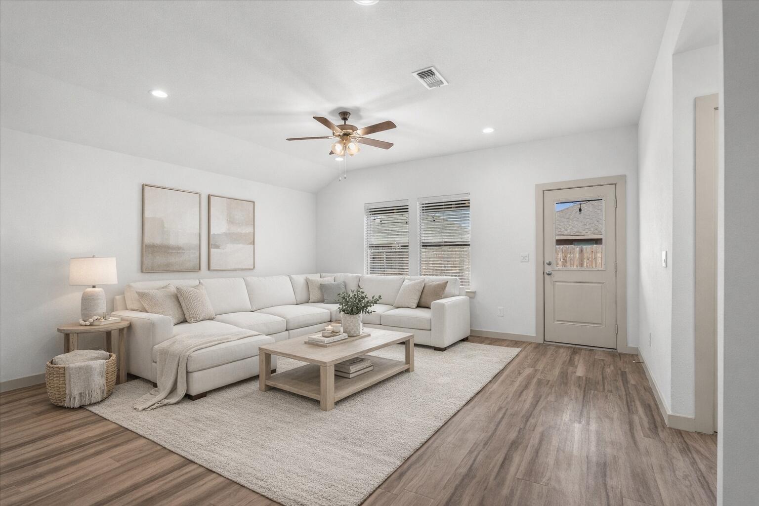 7416 9th Street Lubbock, TX 79416 - Photo 5 of 34 a living room with furniture and wooden floor