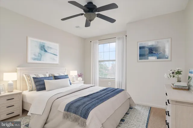 a bedroom with a large bed and a window