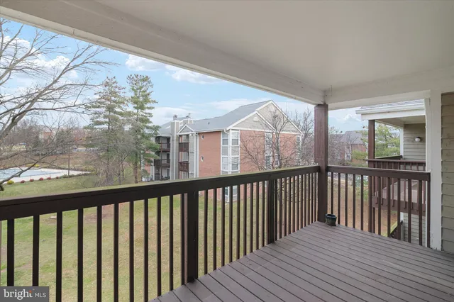 a view of balcony with wooden floor