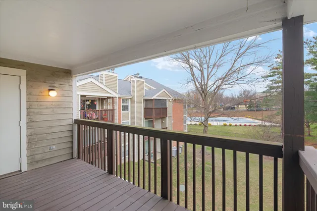 a view of a houses from a balcony