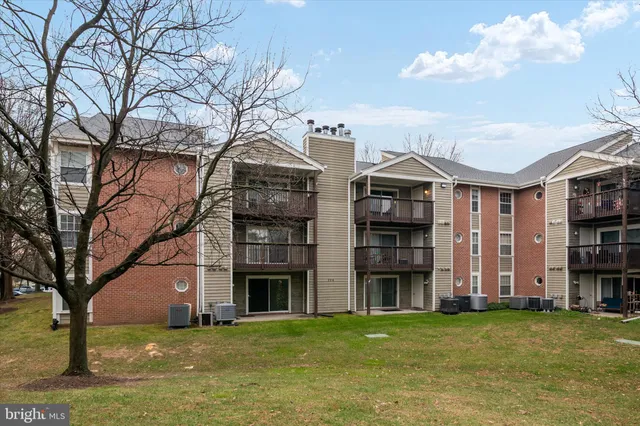 a front view of building with yard