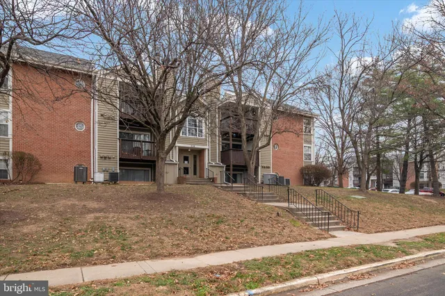 a view of a house with a snow on the road