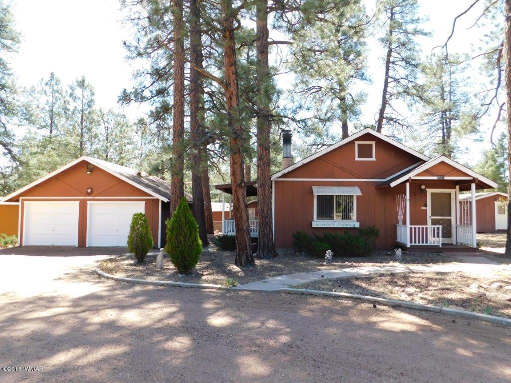 2021 Lumber Valley Road Overgaard, AZ 85933 - Photo 34 of 39 a front view of a house with a yard