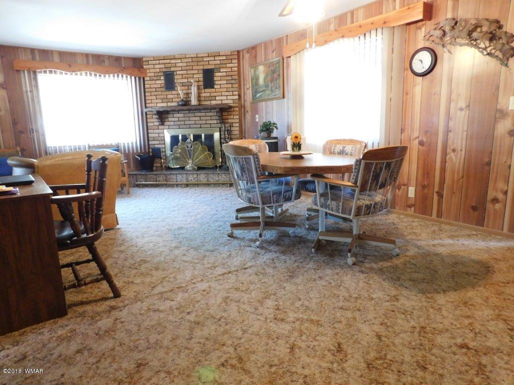 2021 Lumber Valley Road Overgaard, AZ 85933 - Photo 36 of 39 a dining room with furniture and a window