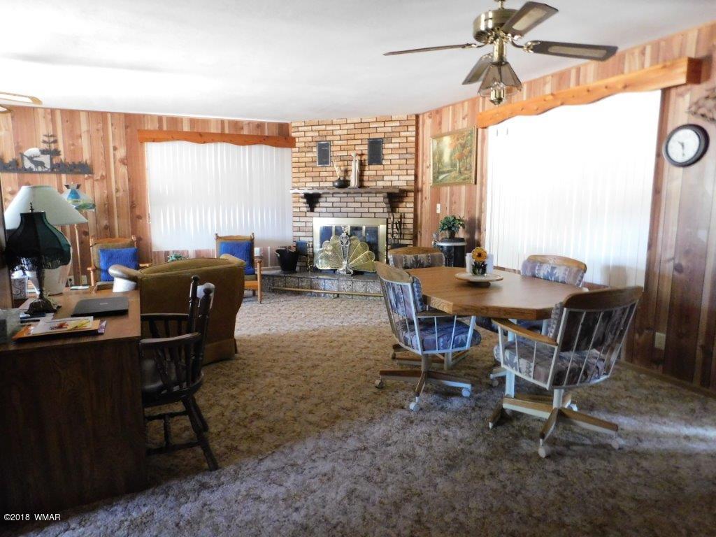 2021 Lumber Valley Road Overgaard, AZ 85933 - Photo 38 of 39 a view of a dining room with furniture window and outside view