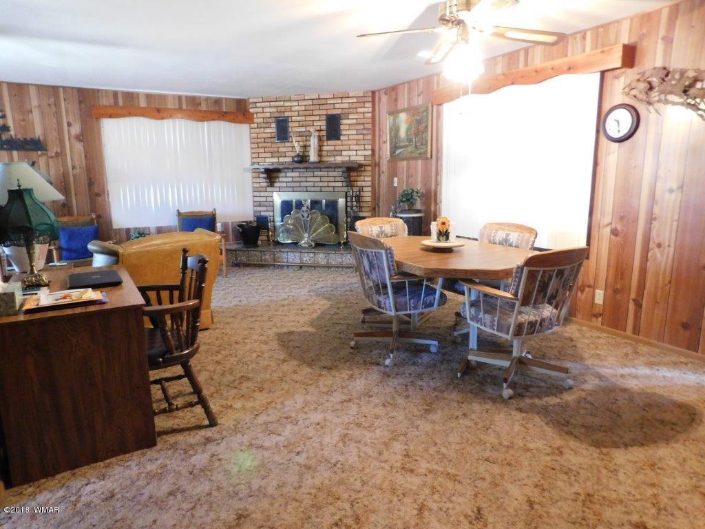 2021 Lumber Valley Road Overgaard, AZ 85933 - Photo 5 of 39 a view of a dining room with furniture and a window
