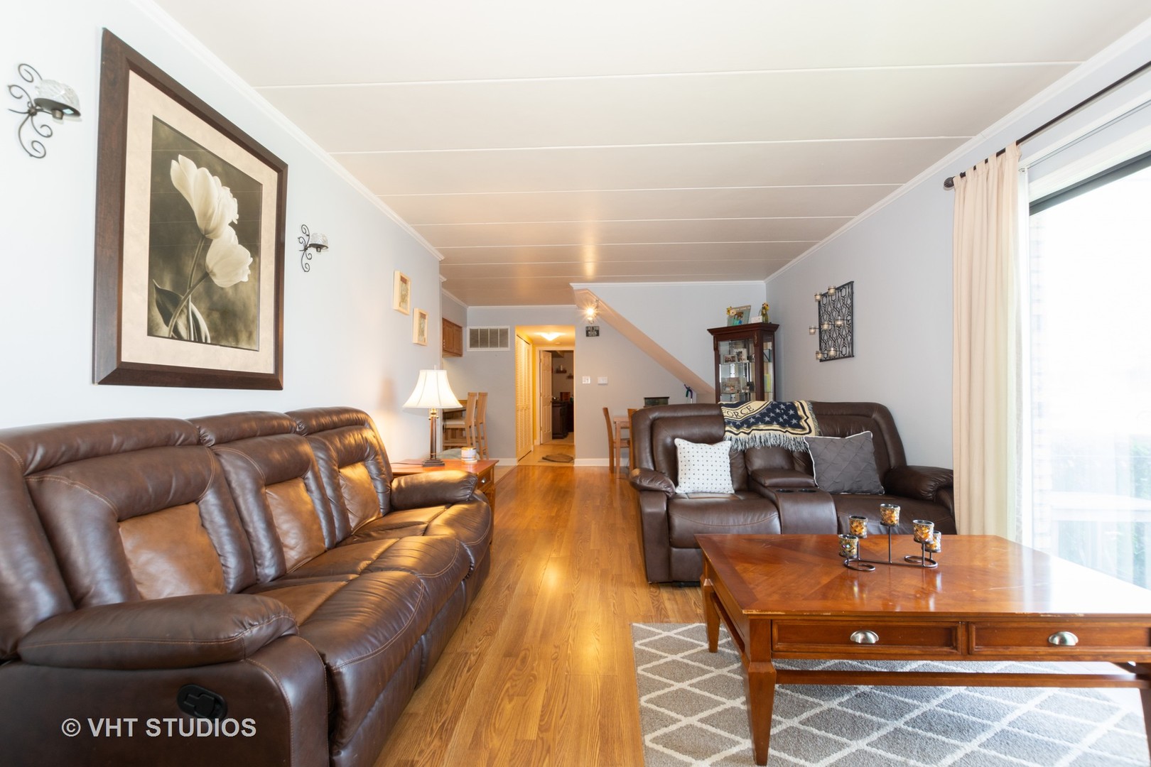 9830 Sayre Avenue, Unit 1 Chicago Ridge, IL 60415 - Photo 2 of 11 a living room with furniture and a wooden floor