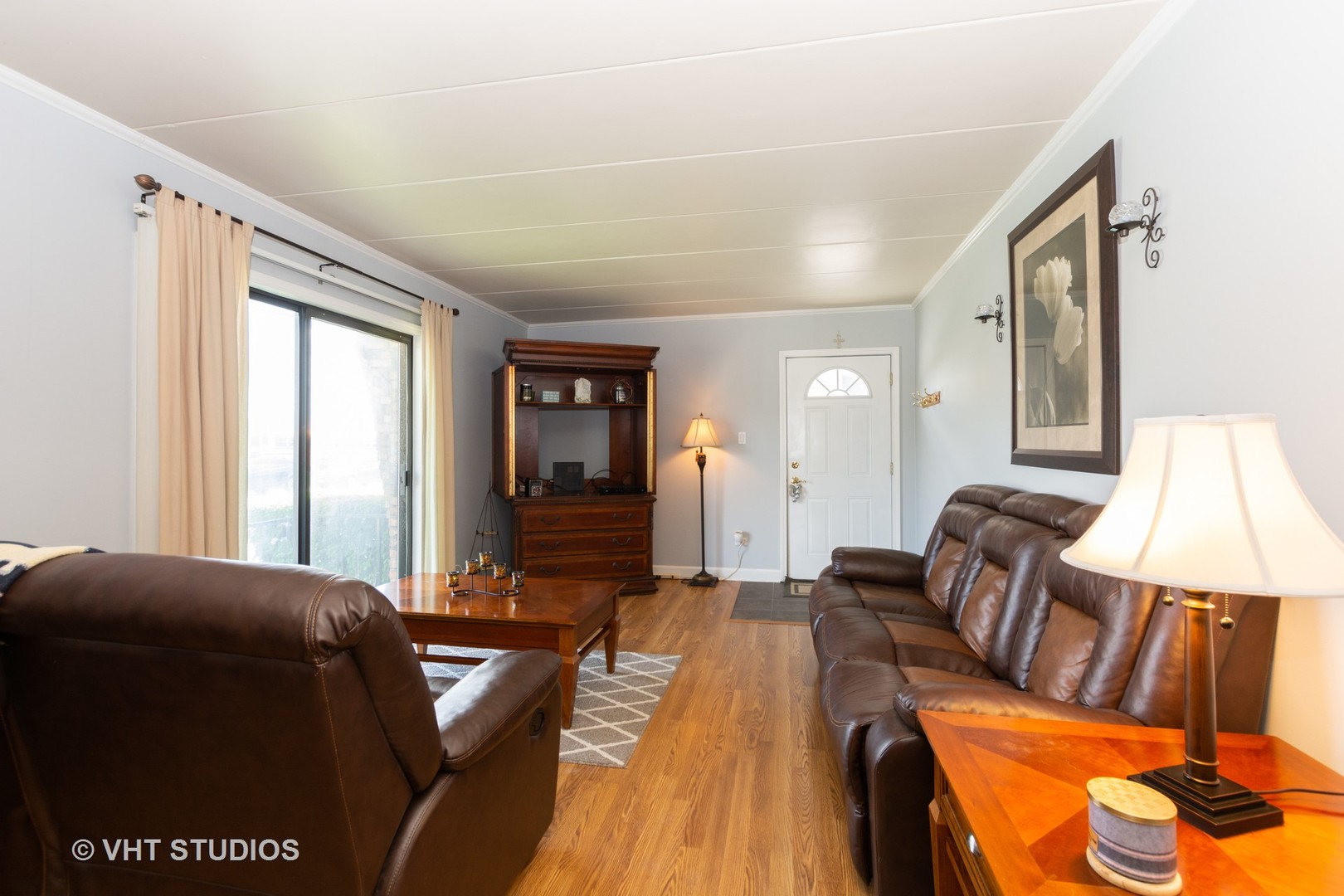 9830 Sayre Avenue, Unit 1 Chicago Ridge, IL 60415 - Photo 3 of 11 a living room with furniture and a window