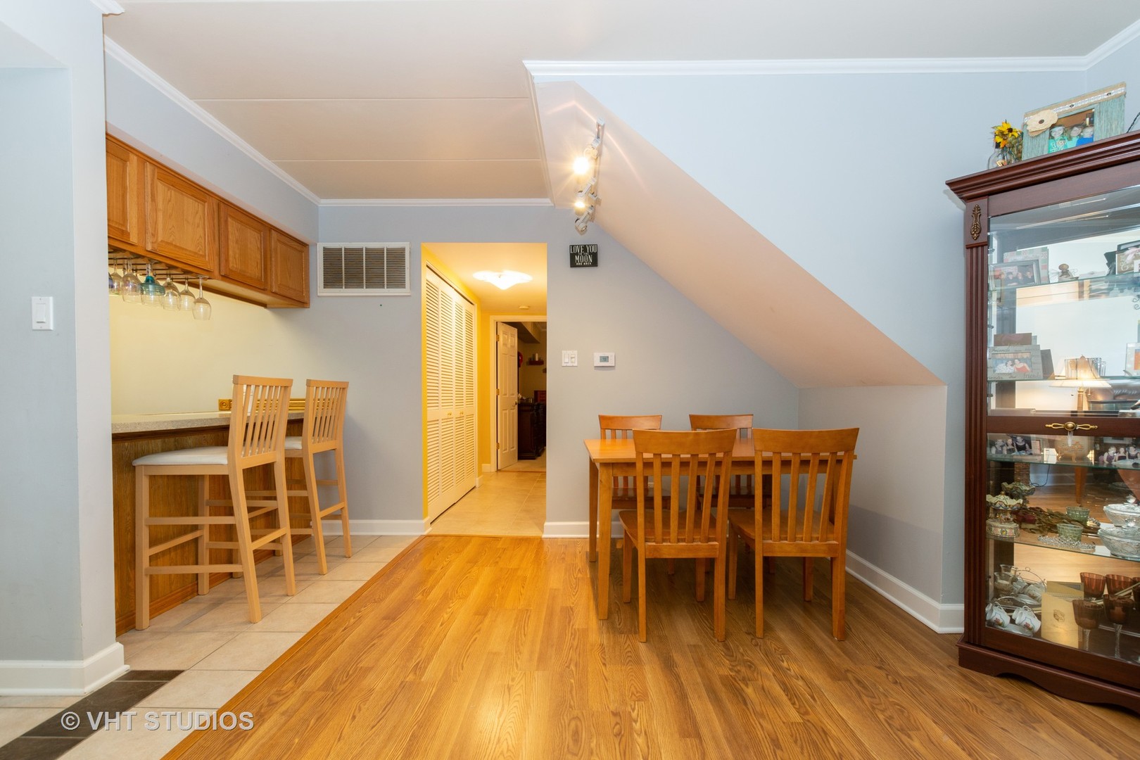9830 Sayre Avenue, Unit 1 Chicago Ridge, IL 60415 - Photo 6 of 11 a dining room with furniture and wooden floor