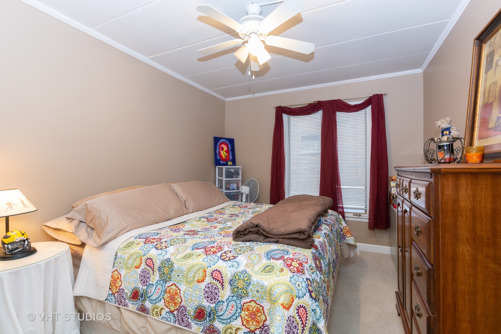 9830 Sayre Avenue, Unit 1 Chicago Ridge, IL 60415 - Photo 9 of 11 a bedroom with a bed and a chandelier
