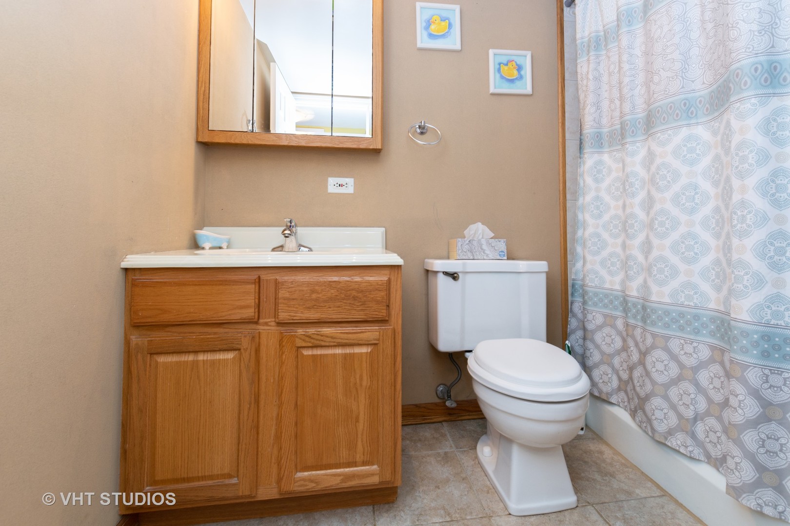 9830 Sayre Avenue, Unit 1 Chicago Ridge, IL 60415 - Photo 10 of 11 a bathroom with a granite countertop toilet and a sink