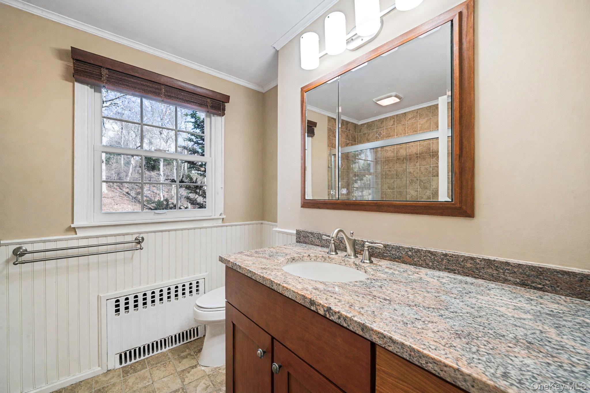 1 Spring Hollow Road Nissequogue, NY 11780 - Photo 11 of 17 a bathroom with a granite countertop sink and a window